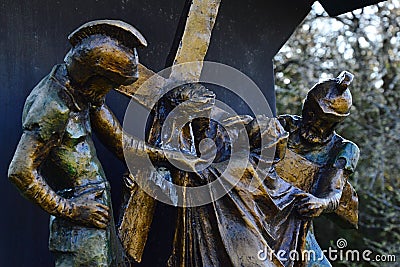 Religious bronze sculptural group of Sixth Station Of The Cross - Veronica also as Berenike wipes the face of Jesus. Editorial Stock Photo