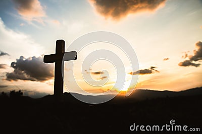 Religious concepts. Christian wooden cross on a background with dramatic lighting, Jesus Christ cross, Easter, resurrection Stock Photo