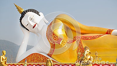 Religious concepts, Statue of Buddha in sky background Giant Buddha Statue Stock Photo