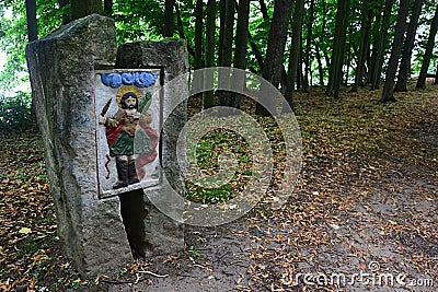 Religious icon placed in stone column on Island Of Art on Orava River Dam, northern Slovakia. Editorial Stock Photo