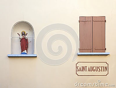 Religious image in wall. Stock Photo