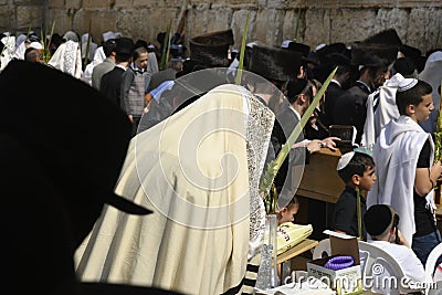 Religious men praying at the wailing wall in Jerusalem during Sukkot Editorial Stock Photo