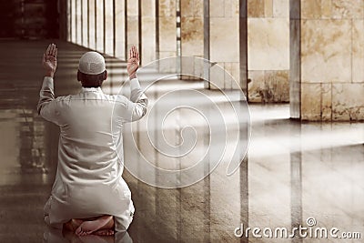 Religious muslim man praying Stock Photo