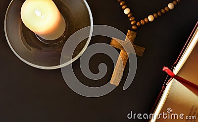 Religious nightstand to pray with cross bible and candle top Stock Photo