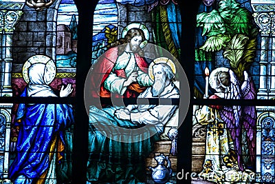 Religious stained glass mural Stock Photo