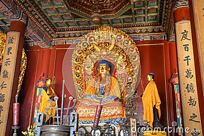 Religious statue at Yonghegong Lama Temple in Beijing, China Editorial Stock Photo