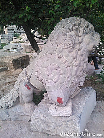Remain heritage, a stone lion, from destruction at Old Summer Palace, Yuanmingyuan Park Beijing China Stock Photo