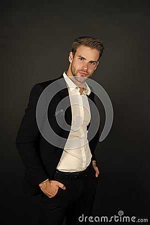 Remaining conservative in style. Stylish businessman dark background. Modern man in office style. Professional wardrobe Stock Photo