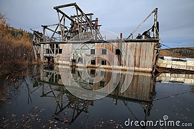 The remains of delelict mining dredge outside of Dawson City,Canada Stock Photo