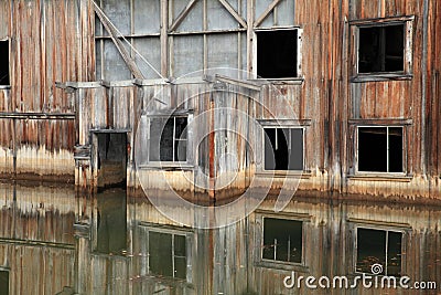 The remains of delelict mining dredge outside of Dawson City,Canada Stock Photo