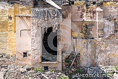 Remains of hurricane or earthquake aftermath disaster damage on ruined old houses with collapsed roof and wall Stock Photo