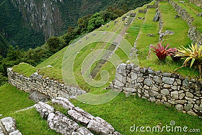 Remains of Inca Agricultural Terraces on the Mountain Slope of Machu Picchu Citadel, Sacred Valley of the Inca in Cuzco, Peru Stock Photo
