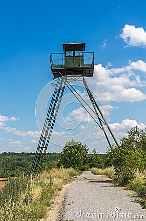 Remains of iron curtain with watchtower Stock Photo