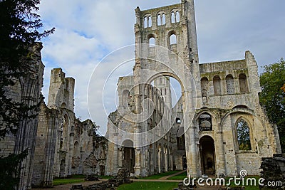 The remains of the portal and ruined walls of medieval benedictine Jumieges Abbey Editorial Stock Photo