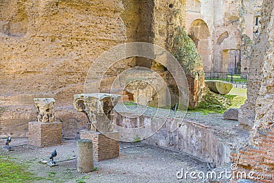 Remains of Roman column ( capitals ) in the ruins of ancient Roman Baths of Caracalla (Thermae Antoninianae) Stock Photo