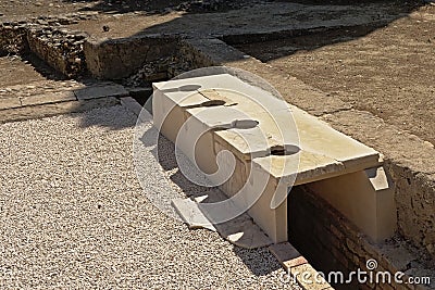 Remains of Roman toilets in Italica archeological site, seville Editorial Stock Photo