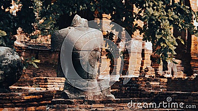 Remains of ruined Buddha figure in sitting poses at Ayutthaya Historical park, Thailand. Stock Photo