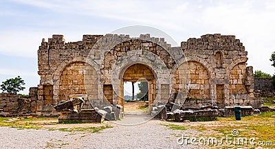 Remains of stone city gate in ancient city of Perge in Turkey Stock Photo
