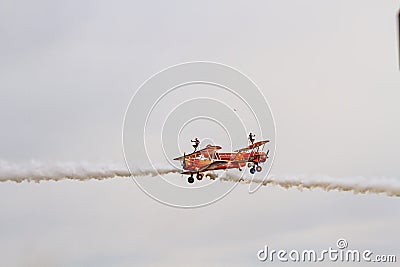 Remarkable close pass during a wingwalking display Editorial Stock Photo