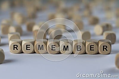 Remember - cube with letters, sign with wooden cubes Stock Photo