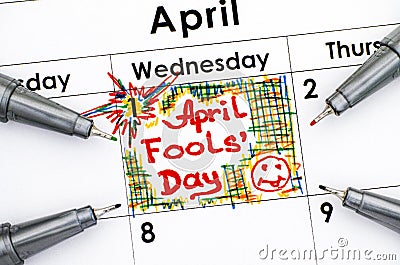 Reminder April fools day in calendar with four pens. Stock Photo