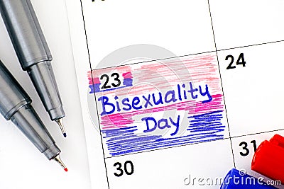 Reminder Bisexuality Day in calendar with red and blue pens Stock Photo