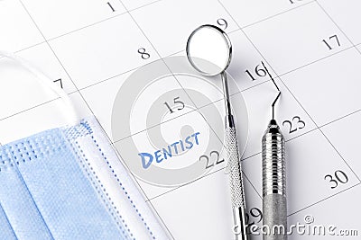 Reminder dentist appointment in calendar and professional dental tools Stock Photo