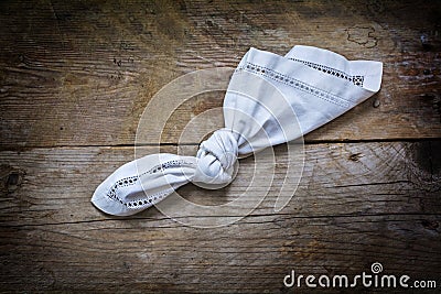 Reminder, knot in handkerchief of white cloth on a rustic wooden Stock Photo