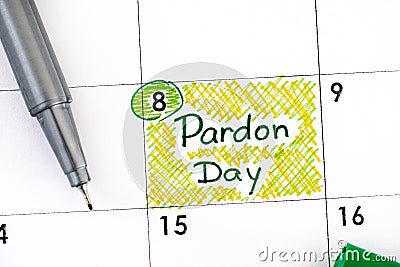 Reminder Pardon Day in calendar with pen Stock Photo