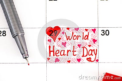 Reminder World Heart Day in calendar with red pen Stock Photo