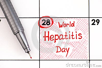 Reminder World Hepatitis Day in calendar with pen Stock Photo