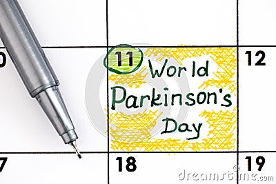 Reminder World Parkinson`s Day in calendar with pen Stock Photo