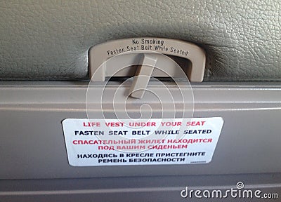 Reminding inscriptions on seats in cabin Stock Photo