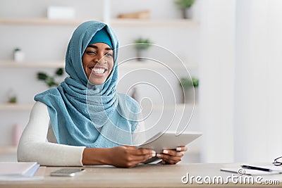 Remote Career. Portrait Of Happy Black Muslim Freelancer Lady With Digital Tablet Stock Photo