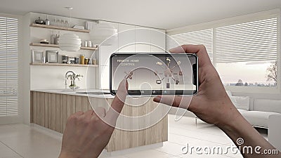 Remote home control system on a digital smart phone tablet. Device with app icons. Interior of modern kitchen with shelves and cab Stock Photo