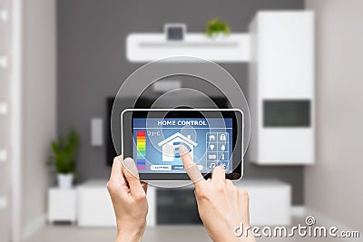 Remote home control system on a digital tablet. Stock Photo