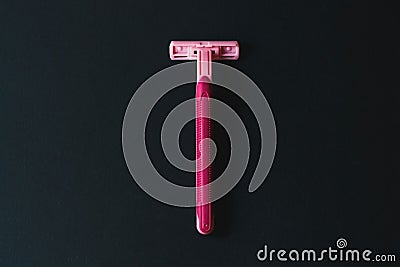 Removal of unwanted hair, concept. Disposable shaving machine for women Stock Photo