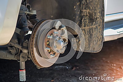 Remove the wheel to repair brake system. Stock Photo