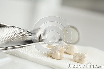 Removed wisdom tooth on white Stock Photo
