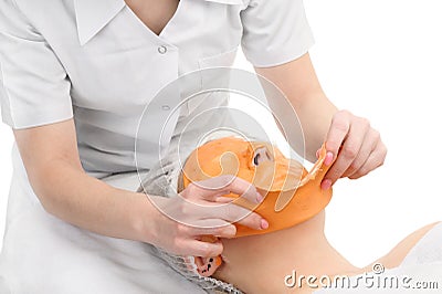 Removing alginate peel-off facial mask Stock Photo