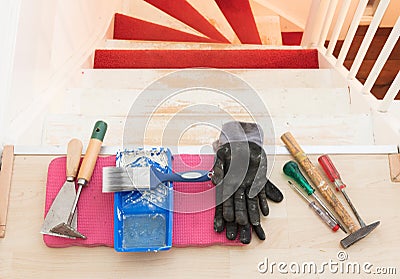 Removing carpet, glue and paint from an vintage stairs Stock Photo