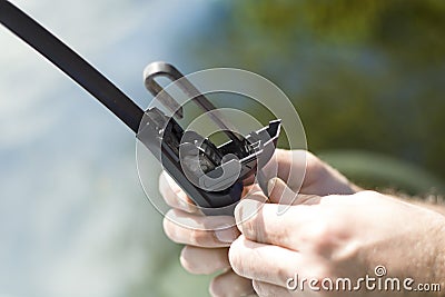 Removing the damaged wiper from the arm. Stock Photo