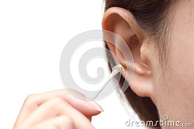 Removing ear wax using a cotton bud Stock Photo