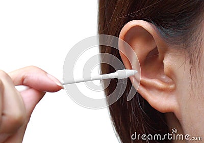 Removing ear wax using a cotton bud Stock Photo