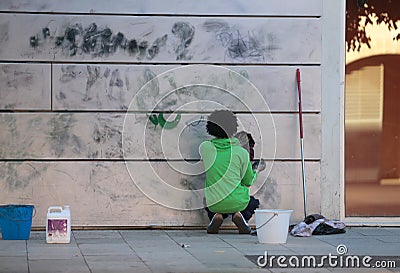 Removing graffiti paintings Editorial Stock Photo