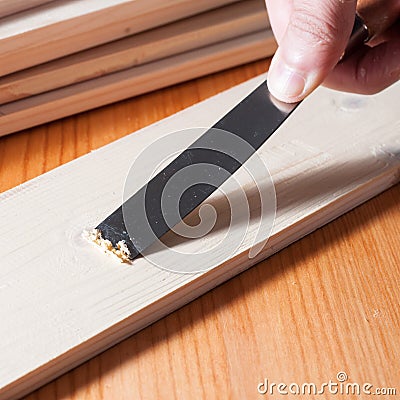 Removing paint from a wood surface Stock Photo