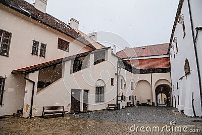 Renaissance courtyard, Baroque medieval castle with stone gothic tower, historical building on the Otava, snow in winter day, Editorial Stock Photo