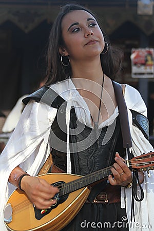 Musicians dressed in Medieval costumes at a renaissance faire Editorial Stock Photo