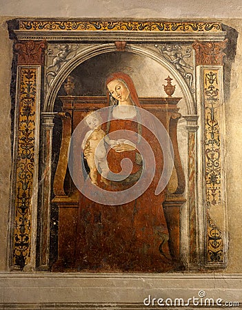 Fresco Holy Virgin Mary child Christ Pubblico, Siena, Italy, night Stock Photo