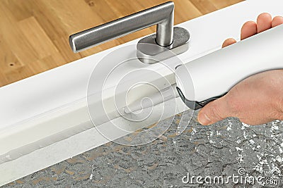 Renewing silicone joint on a window Stock Photo